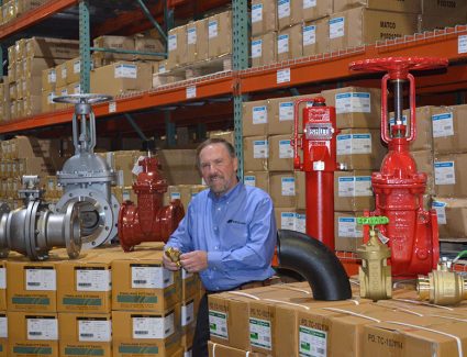 Dov, co-founder of Matco Norca, in the a warehouse with SVF products